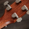 Taylor Gold Label 510e LR Baggs Element VTC Natural Electro Acoustic Guitar with Hardshell case Close-up of a wooden guitar headstock with chrome tuning pegs.